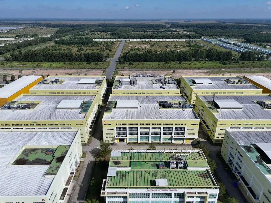 Aerial shot of a modern industrial complex surrounded by greenery in Bình Dương, Vietnam.