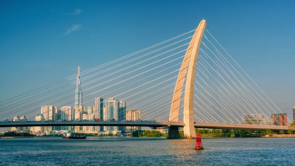 A stunning view of the Thu Thiem Bridge with the Ho Chi Minh City skyline in the background.
