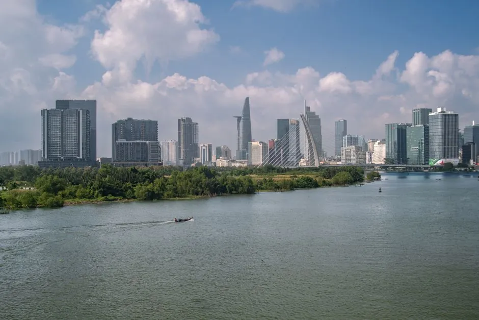 Captivating view of Ho Chi Minh City's skyline featuring modern architecture and Saigon River.