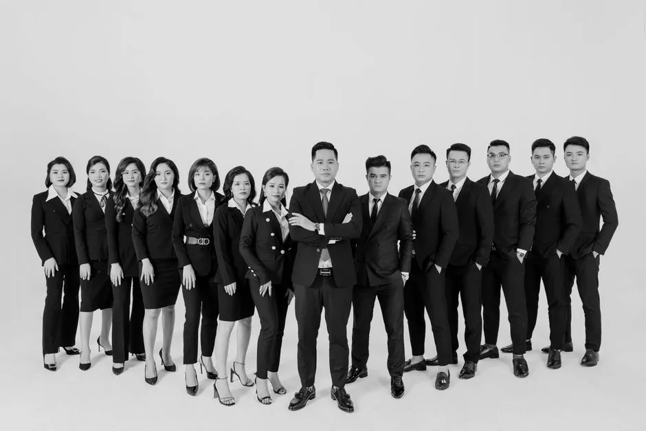 Black and white portrait of a diverse business team in a studio setting.
